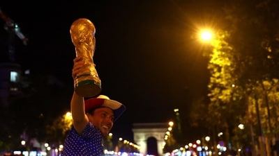 France fan celebrates with a replica World Cup trophy at Champs-Elysees after the match REUTERS/Abdul Saboor (REUTERS/Representational)