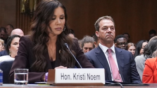Homeland Security Secretary Kristi Noem, left, and her husband Bryon Noem, right, appears for an oversight hearing before the Senate Judiciary Committee, at the Capitol in Washington, Tuesday, March 3, 2026. Her husband, Bryon Noem, is seated at center. (AP Photo/J. Scott Applewhite)(AP)