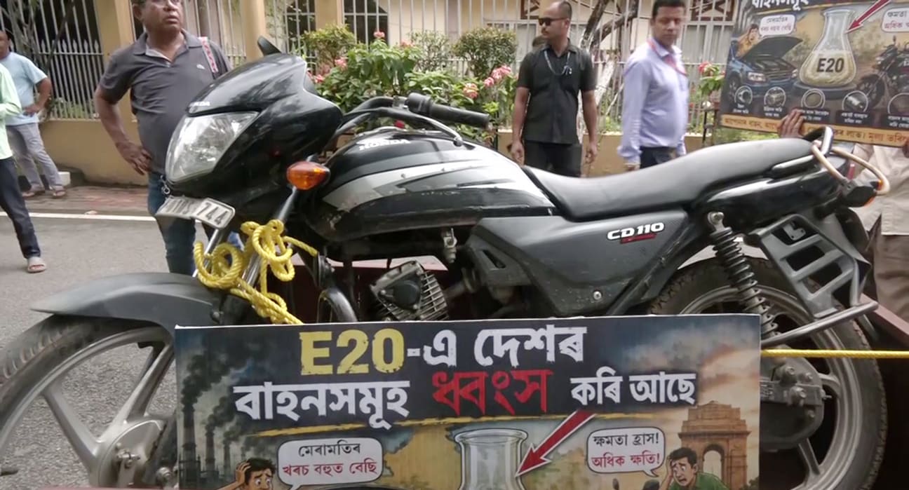 A poster that raises concerns about the rollout of E20 ethanol-blended fuel, during a protest in Assam. (ANI Video Grab) A poster that raises concerns about the rollout of E20 ethanol-blended fuel, during a protest in Assam. (ANI Video Grab)