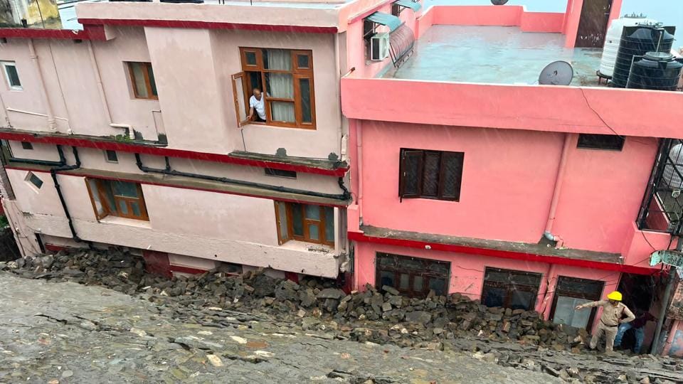 The ground floor of buildings was blocked after the landslide, trapping nearly 40 people from eight families inside their homes in Nahan on Friday. (HT Photo) The ground floor of buildings was blocked after the landslide, trapping nearly 40 people from eight families inside their homes in Nahan on Friday. (HT Photo)