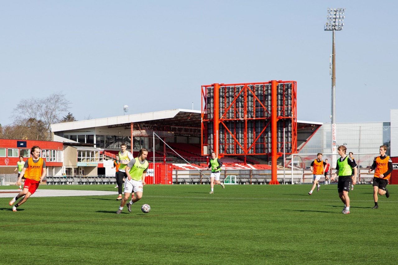 Young men play football on the pitch of the Jaerhallen stadium in Bryne, Norway. Young men play football on the pitch of the Jaerhallen stadium in Bryne, Norway.