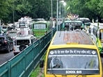 A long queue of buses carrying farmers heads towards Matka Chowk in Chandigarh on Friday. (Ravi Kumar/HT)