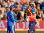 England's skipper Harry Brook exchanges a handshake with Indian skipper Shreyas Iyer. 
