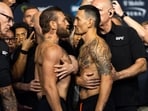 Conor McGregor (left) faces off with Max Holloway during weigh ins for UFC 329 at T-Mobile Arena. 