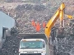 8 people are still believed to be trapped under debris as a massive mound of garbage collapsed onto a building in Pune