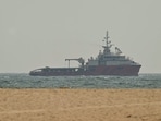 A ship sails off the coast of Ajman on July 10, 2026. Traffic through the Strait of Hormuz has fallen sharply, especially through the UN-backed Omani route.