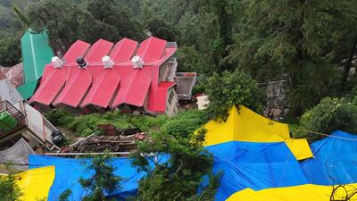 A landslide occurred near Sanjauli College in Shimla on Saturday morning, endangering several houses. The area has been covered with tarpaulin to prevent further slippage. (Deepak Sansta/HT) A landslide occurred near Sanjauli College in Shimla on Saturday morning, endangering several houses. The area has been covered with tarpaulin to prevent further slippage. (Deepak Sansta/HT)