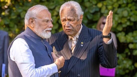 India's Prime Minister Narendra Modi, left, listens as a Māori elder explains the ceremonial welcome at Government House in Auckland, New Zealand, Saturday, July 11, 2026. (AP)