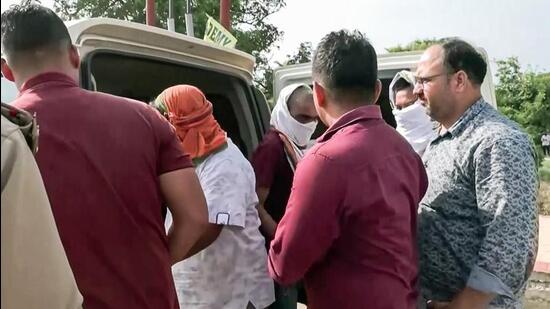 Police take three jailed accused in Ram temple donations embezzlement case -- Anukalp Mishra, Lavkush Mishra and Karunesh Pandey -- for further proceedings, in Ayodhya on Wednesday (July 8). (ANI VIDEO GRAB)