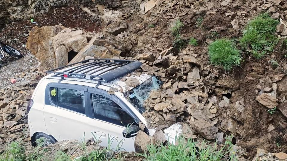 One of the two parked vehicles that were buried in debris after a landslide at Mohal Rajhana in the suburbs of Shimla on Saturday. (Deepak Sansta/HT) One of the two parked vehicles that were buried in debris after a landslide at Mohal Rajhana in the suburbs of Shimla on Saturday. (Deepak Sansta/HT)