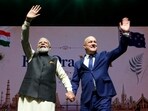 Prime Minister Narendra Modi and New Zealand Prime Minister Christopher Luxon wave during Indian community Event, in Auckland on Saturday. 