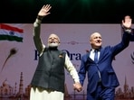 Prime Minister Narendra Modi and New Zealand Prime Minister Christopher Luxon wave during Indian community Event, in Auckland on Saturday. 