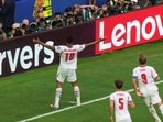 England's Jude Bellingham (10) celebrates after scoring his side's second goal as John Stones (5) and Harry Kane (9) look on during the World Cup quarterfinal soccer match between Norway and England
