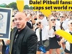Rapper Pitbull shows the Guinness World Record as his fans, flaunting bald caps, rejoice at Hyde Park in London. (Photos: AFP) Rapper Pitbull shows the Guinness World Record as his fans, flaunting bald caps, rejoice at Hyde Park in London. (Photos: AFP)
