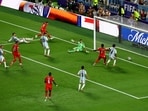 Switzerland's Dan Ndoye scores their first goal past Argentina's Emiliano Martinez