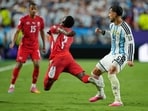 Switzerland's Breel Embolo (7) reacts in a challenge from Argentina's Leandro Paredes (5) during the World Cup quarterfinal soccer match between Argentina and Switzerland in Kansas City, Mo., Saturday, July 11, 2026. (AP Photo/Ashley Landis)