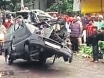 The mangles car being taken by police. (HT)