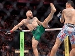 Conor McGregor, left, attacks Max Holloway with a kick at the start of a welterweight fight during UFC 329 Saturday, July 11, 2026, in Las Vegas. (Steve Marcus/Las Vegas Sun via AP)