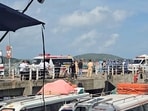 Ambulances line up on a pier to help victims of a boating accident after a tourist vessel capsized off Phu Quoc Island in southern Vietnam.