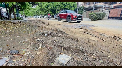Damaged road at BRS Nagar in Ludhiana on Sunday. (Gurpreet Singh/HT)