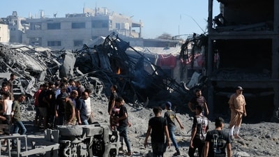 Palestinians gather at the site of an Israeli military drone strike on a blacksmith shop in Gaza City's Sabra neighbourhood on Sunday, July 12, 2026. The strike killed at least four Palestinians and wounded another, according to officials at Shifa Hospital, where the casualties were taken. (AP Photo/Jehad Alshrafi) Palestinians gather at the site of an Israeli military drone strike on a blacksmith shop in Gaza City's Sabra neighbourhood on Sunday, July 12, 2026. The strike killed at least four Palestinians and wounded another, according to officials at Shifa Hospital, where the casualties were taken. (AP Photo/Jehad Alshrafi)