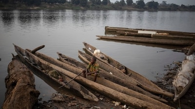 Wooden canoes on the banks of the Oubangui River in Bangui, Central African Republic. Wooden canoes on the banks of the Oubangui River in Bangui, Central African Republic.
