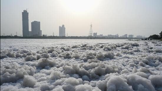 The river still remained polluted with sheets of toxic white foam seen at Kalindi Kunj Ghat on Sunday. (Ajay Aggarwal/HT Photo)