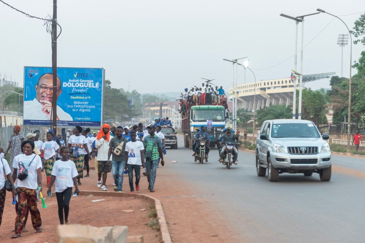 Supporters of President Faustin-Archange Touadéra drive through Bangui. Supporters of President Faustin-Archange Touadéra drive through Bangui.