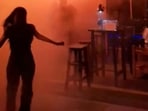 This screengrab from a video released by Kan Kutirat on July 12, 2026, shows people fleeing the fire at Rong Beer Na Lat Phrao bar in Bangkok. The blaze, which broke out late on July 12, killed at least 27 people and injured dozens.
(Photo by Handout / Courtesy of Kan KUTIRAT / AFP)