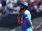 Shreyas Iyer looks on.