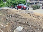 Damaged road at BRS Nagar in Ludhiana on Sunday. (Gurpreet Singh/HT)