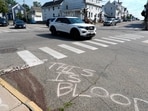 Blood is seen on the pavement near the scene of a shooting involving U.S. Immigration and Customs Enforcement, Monday, July 13, 2026 in Biddeford, Maine.