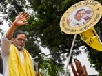 Jan Suraaj Party founder Prashant Kishor greets supporters during a roadshow for the Bankipur assembly bypoll in Patna on Monday. (PTI)