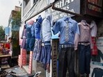 New Delhi, India - August 16, 2020: School uniforms hanged outside a shop in Gandhi Nagar, New Delhi, India, on Sunday, August 16, 2020. School uniforms manufacturers and sellers are facing many problems as schools are closed amid the Covid-19 pandemic and uniforms are stocked in godowns and shops. (Photo by Biplov Bhuyan/ Hindustan Times) **To go with Manoj Sharma's story (Biplov Bhuyan/HT PHOTO)