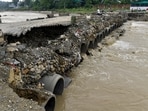  A portion of a temporary bridge built in Premnagar Nanda ki Chowki, washed away due to strong river currents, in Dehradun, Uttarakhand.