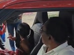 A Hyderabad cop was suspended after allowing his granddaughter, a minor, to drive a car on a busy road(X/@CYBTRAFFIC)