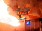 The footage captured people rushing to escape as thick black smoke rises into the sky.