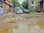 The dilapidated condition of the road in Basant Nagar in Ludhiana. (Gurpreet SinghHT) The dilapidated condition of the road in Basant Nagar in Ludhiana. (Gurpreet SinghHT)
