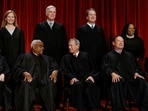 Here's why Amy Coney Barrett and Elena Kagan are testifying before Congress.  Seated (L-R): Justices Sonia Sotomayor, Clarence Thomas, Chief Justice John G. Roberts, Jr., Samuel A. Alito, Jr. and Elena Kagan. Standing (L-R): Justices Amy Coney Barrett, Neil M. Gorsuch, Brett M. Kavanaugh and Ketanji Brown Jackson. (REUTERS/Evelyn Hockstein/File Photo)