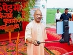 Uttar Pradesh chief minister Yogi Adityanath during the plantation drive in Gorakhpur on Sunday. (ANI PHOTO)