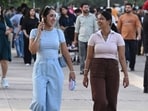 Visitors taking a stroll at Sukhna Lake in Chandigarh on Sunday. (Keshav Singh/HT)