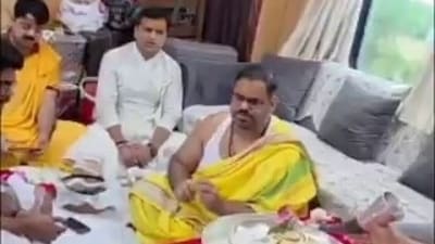 A viral video shows puja rituals being performed inside a moving train. A viral video shows puja rituals being performed inside a moving train.