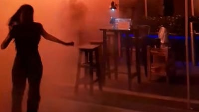 This screengrab from a video released by Kan Kutirat on July 12, 2026, shows people fleeing the fire at Rong Beer Na Lat Phrao bar in Bangkok. The blaze, which broke out late on July 12, killed at least 27 people and injured dozens.
(Photo by Handout / Courtesy of Kan KUTIRAT / AFP) This screengrab from a video released by Kan Kutirat on July 12, 2026, shows people fleeing the fire at Rong Beer Na Lat Phrao bar in Bangkok. The blaze, which broke out late on July 12, killed at least 27 people and injured dozens.
(Photo by Handout / Courtesy of Kan KUTIRAT / AFP)