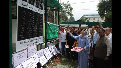 Jammu and Kashmir Peoples Democratic Party (PDP) president Mehbooba Mufti pays tribute at the party headquarters in Srinagar,on Monday. (Waseem Andrabi/HT) Jammu and Kashmir Peoples Democratic Party (PDP) president Mehbooba Mufti pays tribute at the party headquarters in Srinagar,on Monday. (Waseem Andrabi/HT)
