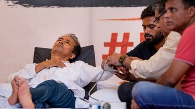 Climate activist Sonam Wangchuk is attended to by a medical professional as Cockroach Janata Party (CJP) founder Abhijit Debaki looks on during a hunger strike by the CJP, (PTI) Climate activist Sonam Wangchuk is attended to by a medical professional as Cockroach Janata Party (CJP) founder Abhijit Debaki looks on during a hunger strike by the CJP, (PTI)