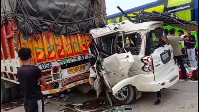 People gather after a car crashed into a parked truck on the National Highway at Ruma in Kanpur on Monday. (PTI) People gather after a car crashed into a parked truck on the National Highway at Ruma in Kanpur on Monday. (PTI)