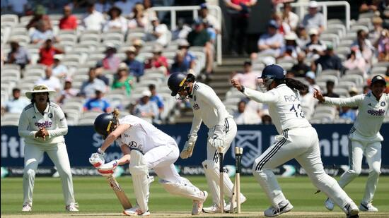 England's Lauren Bell gets bowled out by India's Deepti Sharma. (Action Images via Reuters)