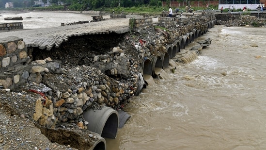 A portion of a temporary bridge built in Premnagar Nanda ki Chowki, washed away due to strong river currents, in Dehradun, Uttarakhand. (PTI)