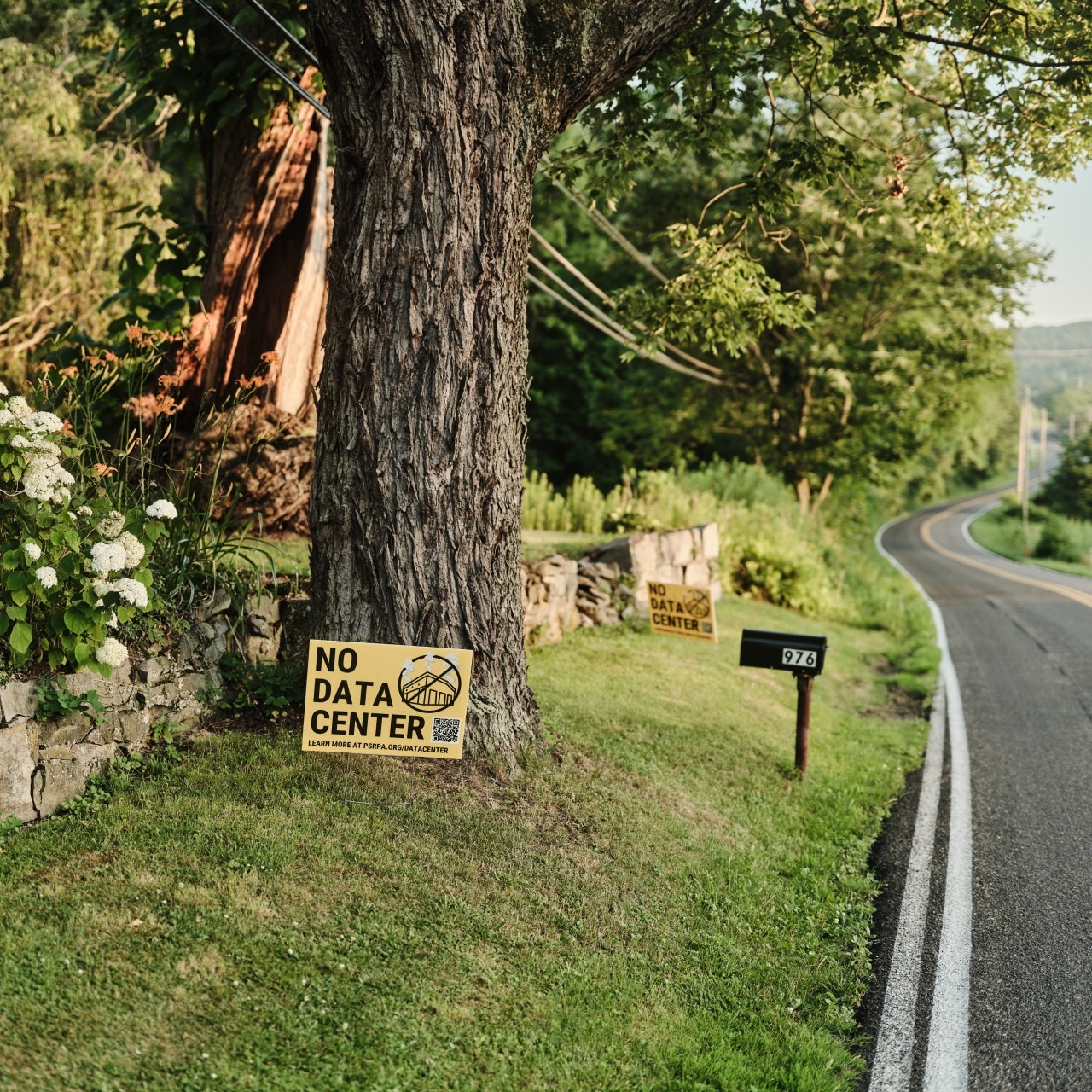 Signs against data centers outside a home in Nescopeck, Pa. Signs against data centers outside a home in Nescopeck, Pa.