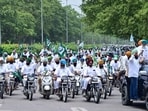 A long queue of Two wheelers carrying farmers heads towards sector 34 in Chandigarh on Monday as they march to protest against the Center government in Chandigarh. (Ravi Kumar/HT)